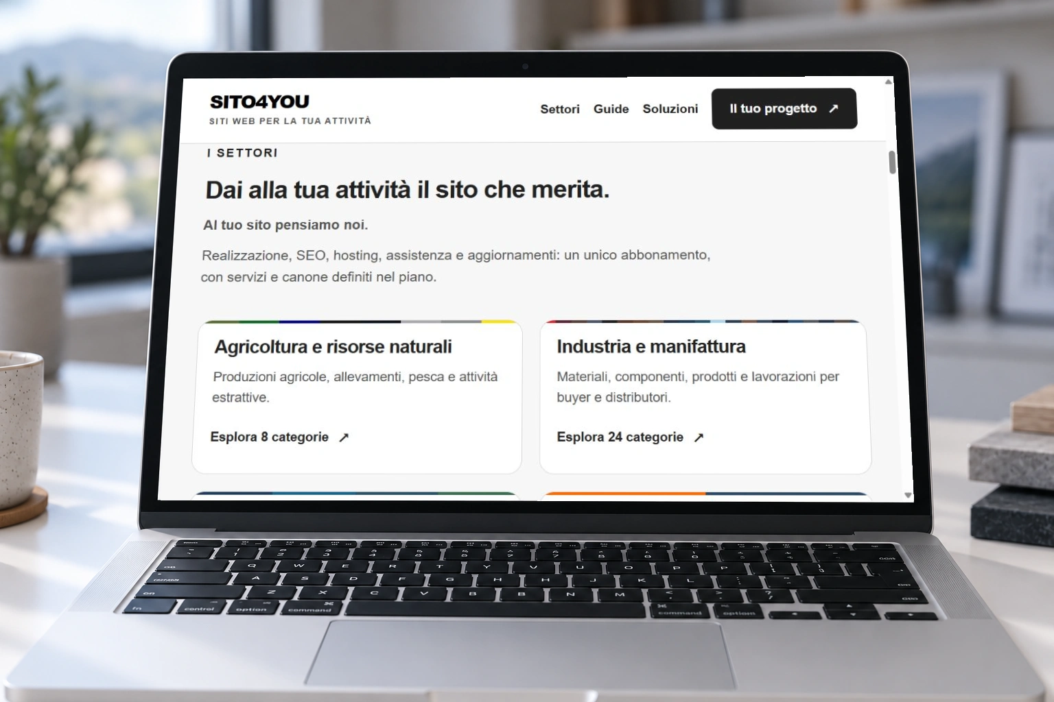Immagine illustrativa: computer con una proposta di sito e immagini di attività produttive, agricoltura e territorio
